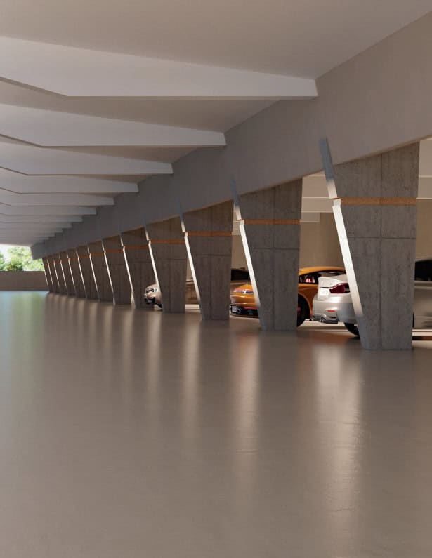 Die Autos werden in einem modernen, sauberen Parkhaus mit Betonpfeilern und größtenteils leerem Boden geparkt.